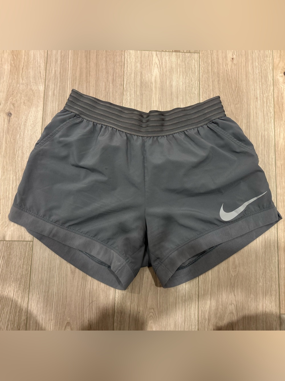 Nike Women's Charcoal Athletic Shorts with Reflective Swoosh